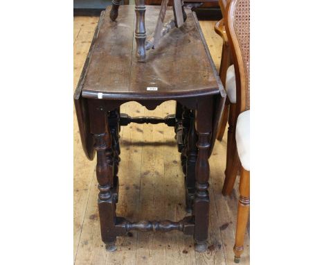 Antique jointed oak gate leg dining table, 71cm high by 111cm wide by 48cm deep (leaves down).