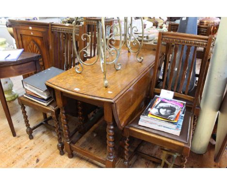 Oak barley twist gate leg dining table and four chairs.