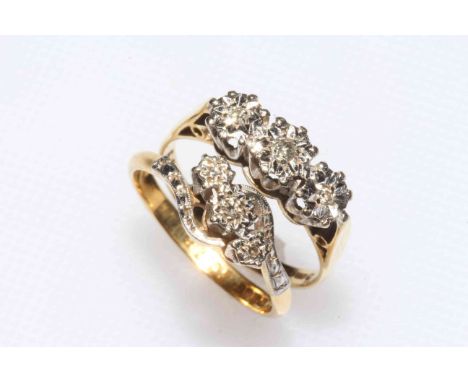 Two 18 carat yellow gold and three stone diamond set rings, sizes M/N.