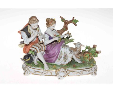 Unterweissbach porcelain pastoral group of pipe playing shepherd and maiden, 25cm across, 18cm high, blue mark.