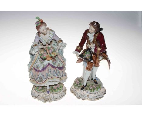 Pair large Sitzendorf porcelain figures of a lady with basket of flowers and gallant in crimson coat, 35cm, blue mark.