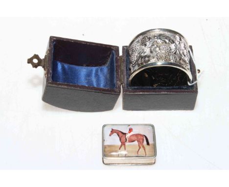 Silver jockey on horseback snuff box, 3.5cm across, and silver vine napkin ring (2).