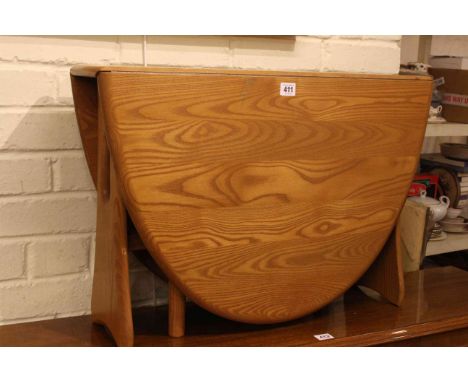 Ercol Windsor drop leaf low centre table, 47cm high by 70cm wide.