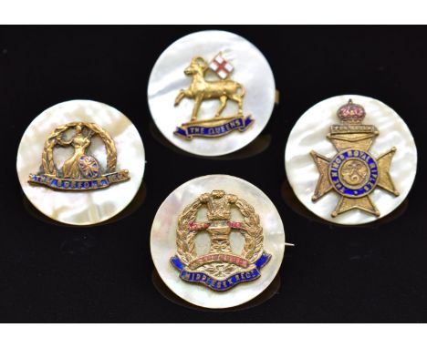 Four mother of pearl, metal and enamel sweetheart brooches for the Middlesex Regiment, The Queen's, King's Royal Rifles and t