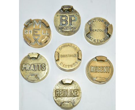 Seven vintage two gallon petrol can caps comprising Redline, Regent, Pratts, Shell Mex, BP and two National Benzole Mixture