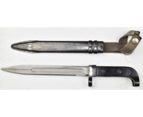 East German MPI K rifle bayonet with 20cm fullered blade, scabbard and frog.&nbsp;PLEASE NOTE ALL BLADED ITEMS ARE SUBJECT TO