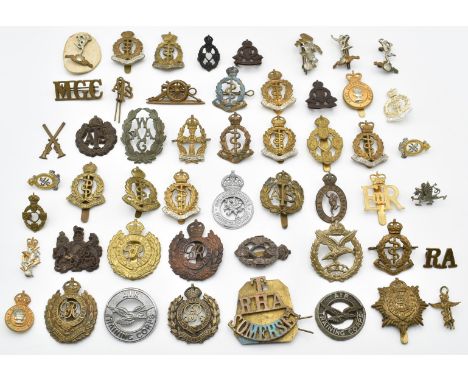 Approximately fifty British Army badges including Royal Army Medical Corps, Royal Engineers, Somerset Territorial, Royal Hors