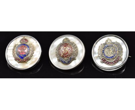 Three mother of pearl and enamel sweetheart brooches for the Royal Engineers, one stamped silver to rim