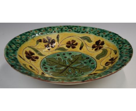 Della Robbia art / studio pottery pedestal bowl with oak leaf cartouche, garland surround and spotted border, signed Violet t