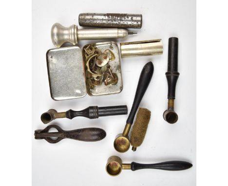 A collection of gun and shooting tools and accessories including powder measures, cartridge de-capping tool, German silver si