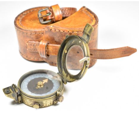 WW1 British Army marching compass with broad arrow mark, serial number 93781, stamped F L 1917, with associated leather case