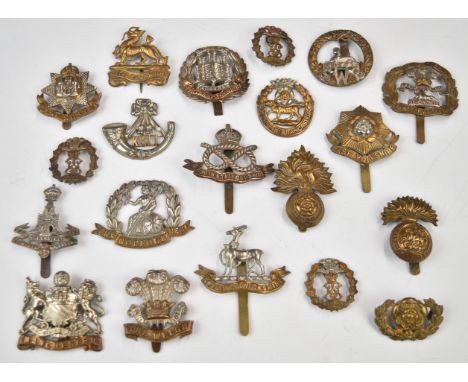 Twenty British Army Infantry badges including Norfolk Regiment, Northumberland Fusiliers, East Surrey etc