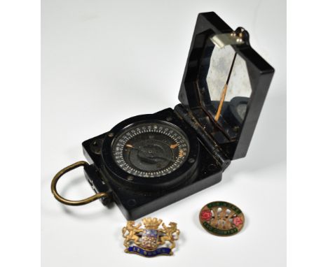 WW2 marching compass Mk1 by TG Co Ltd, with serial number B75492 and broad arrow mark together with two metal and enamel badg