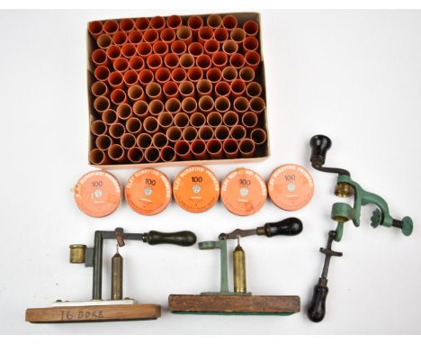 A collection of shotgun cartridge re-loading tools and accessories including 12 bore rollover tool, cappers and de-cappers, n