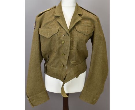 British Army officer's dress blouse 1940 pattern, with Captain rank insignia to shoulder straps and Wessex Division cloth pat