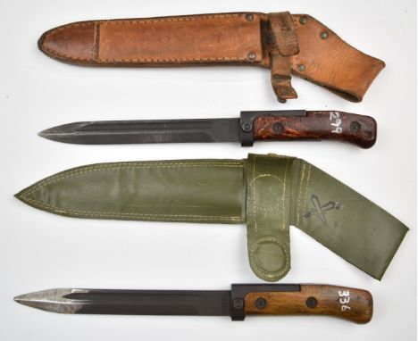 Two Czechoslovakia 1958 pattern bayonets, one with wood grips, 17.5cm fullered blade and plastic sheath dated 1976, the other