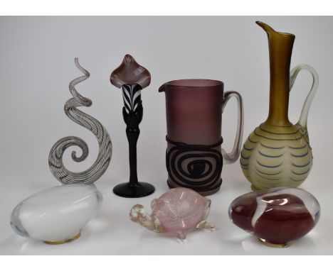 Seven pieces of art glass including two jugs with applied decoration, candlestick, tortoise paperweight etc, largest 33cm tal