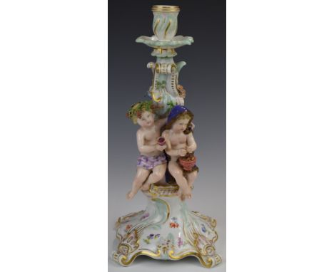 Meissen figural candlestick / centrepiece with applied flower decoration, impressed 147 and with blue crossed swords to base,