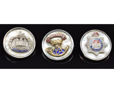 Three mother of pearl and enamel&nbsp;sweetheart brooches for the Somerset Light Infantry, Devonshire Regiment and Dorsetshir