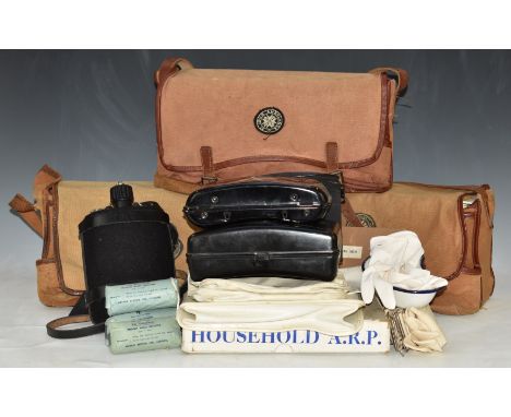 Three St John Ambulance No 15a haversacks, all with metal First Aid cabinets and associated equipment, together with a househ