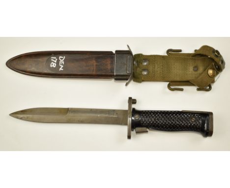 Danish 1955 pattern bayonet with chequered grips, 17cm blade, wooden scabbard marked HTK and frog.&nbsp;PLEASE NOTE ALL BLADE