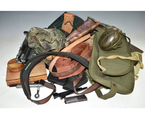 A collection of gun and shooting related accessories including light machine gun slip, rifle slings and slips, revolver or pi