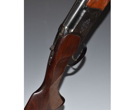 Baikal NX-27E-IC 12 bore over and under ejector shotgun with engraved lock and trigger guard, chequered semi-pistol grip and 