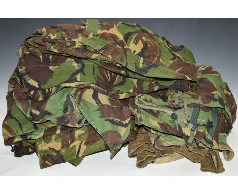 Twelve items of British Army Gloucestershire Regiment Cold War combat clothing including jackets / smocks, trousers and three