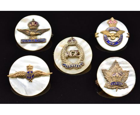 Five mother of pearl, metal and enamel sweetheart brooches comprising three for the Royal Air Force, one for Canada and one f