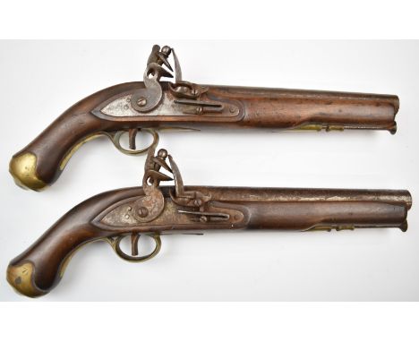 A pair of flintlock pistols each with lock stamped 'Tower' and with crown over 'GR' cypher, line inlaid hammer, brass trigger