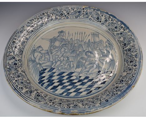 Large Delft charger decorated with an elaborate court scene including harp player, soldier and cherub etc, diameter 53cm