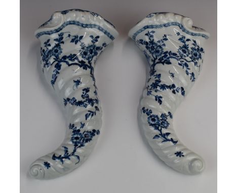 A pair of Worcester first period&nbsp;blue and white cornucopia wall pockets of spiral moulded form, height 27cm