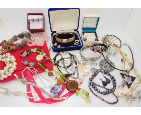 Items by Lola Rose, Swarovski, a gold plated bangle and other items Condition Report: Not available for this lot