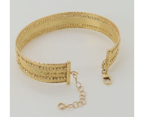 A 9ct gold Italian made bangle, weight 10.8gms Condition Report: Available upon request