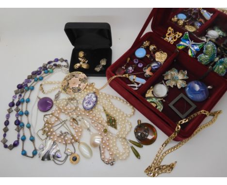 A Michaela Frey locket, opal glass pendant, butterfly pendant and brooches etc Condition Report: Not available for this lot