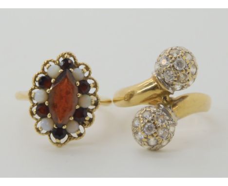 A 9ct gold garnet and opal ring, size R, and a 9ct clear gem set ring size S1/2, weight 9gms Condition Report: Available upon
