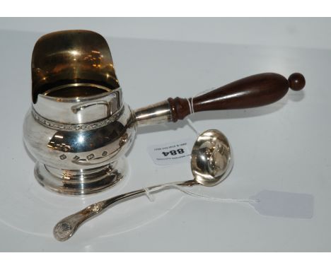 A silver brandy warmer with turned wood handle Birmingham 1989, 22cm long with a silver sauce ladle  Edinburgh marks Conditio