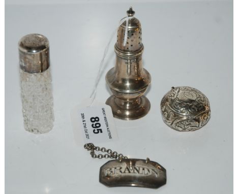 A lot comprising a silver pepperette London 1909, a scent bottle, pill box &amp; a decanter ladle assorted marks Condition Re