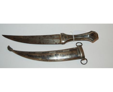 An Eastern dagger with decorative hilt and scabbard, scabbard split Condition Report: Available upon request