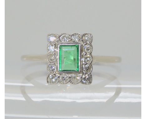 A platinum eight cut diamond and emerald ring, set with estimated approx 0.35cts of diamonds, size R, weight 2.1gms Condition