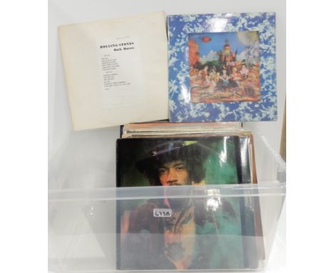 A box of rock and pop vinyl LP albums featuring The Rolling Stones, The Beatles, Slade, Jeff Beck, Steppenwolf, John Mayal, J