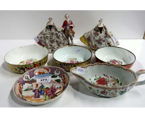 A German figure group of a couple, a similar single figure with Naples mark, three flower painted enamel bowls, a Chinese exp