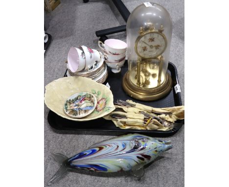 A glass dome mantle clock, a mottled glass model of a fish, Royal Standard floral decorated cups and saucers, EPNS cutlery Co