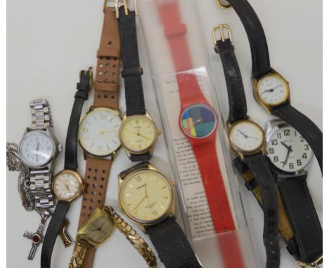 A yellow metal ladies vintage watch, a Swatch watch and other examples Condition Report: Not available for this lot