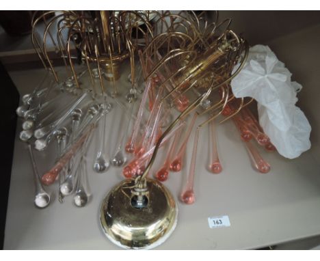 A pair of spider style ceiling light fittings