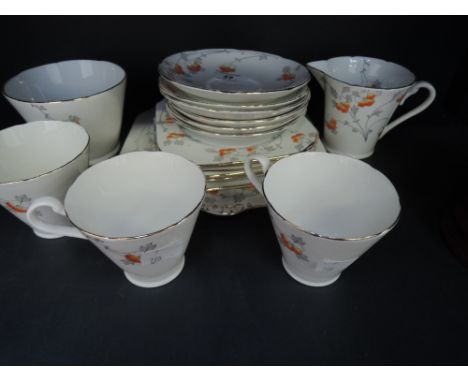 An Art Deco style tea service, Gladstone orange floral pattern