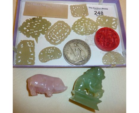 Eight Chinese carved jade plaques and a Hong Kong silver coin, etc.