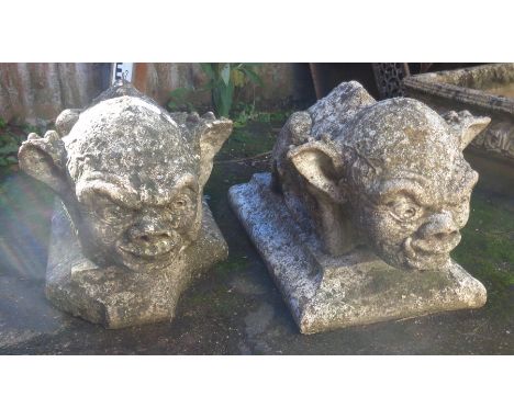 Pair of weathered stonework gargoyle garden ornaments