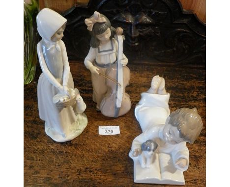 A Nao girl with double bass figure, a boy reading with puppy figure and a Zraphin girl figurine