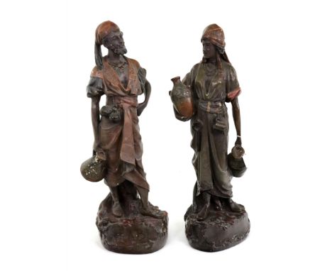 A pair of polychrome painted moulded plaster figures, probably Austrian, in Goldscheider style, circa 1880, the Middle Easter